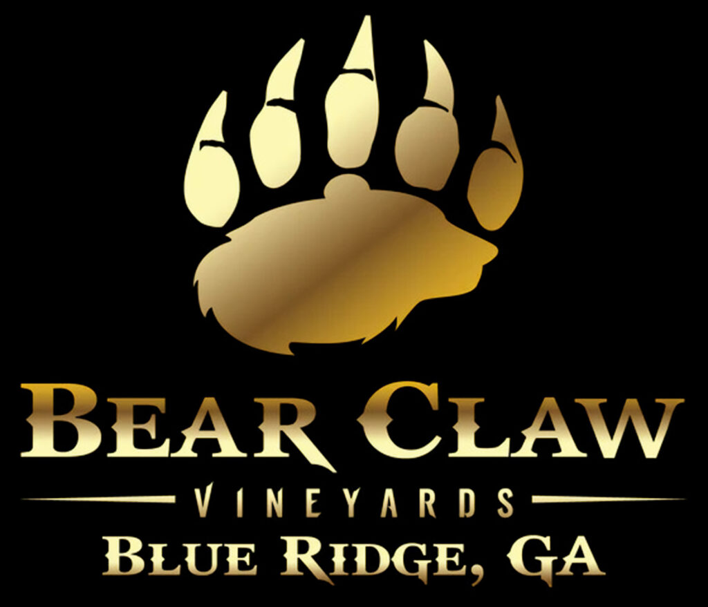 a company logo with bear claw and name of the company Bear Claw Vineyards & Winery, Inc in gold letters