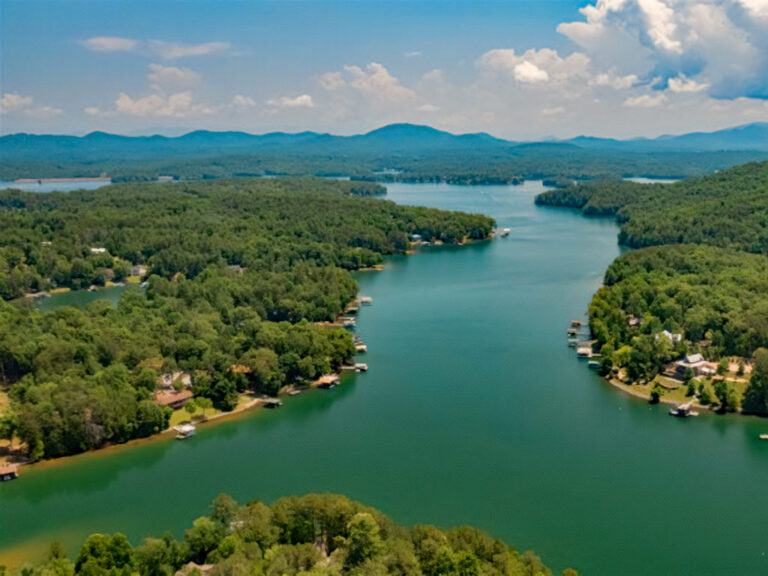 Scenic view of Lake Nottely with mountains in Blairsville, GA, showcasing lakefront charm.